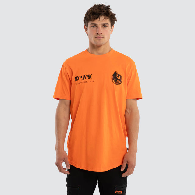 Model wears Collingwood Magpies Ethic Tee Work Orange T-Shirts in Orange - Image 1