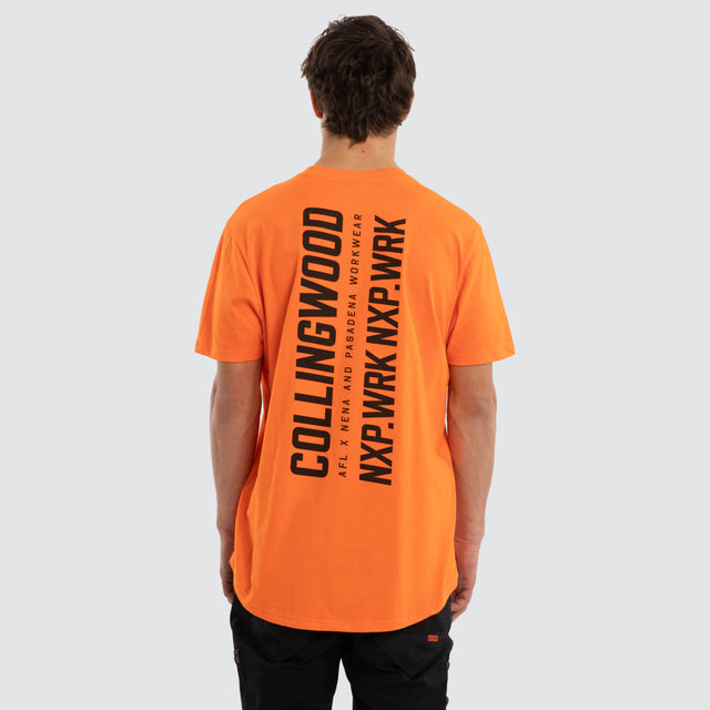 Model wears Collingwood Magpies Ethic Tee Work Orange T-Shirts in Orange - Image 2