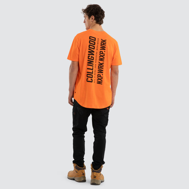 Model wears Collingwood Magpies Ethic Tee Work Orange T-Shirts in Orange - Image 5
