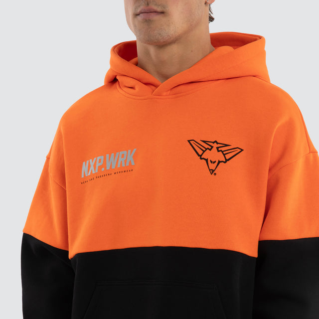 Model wears Essendon Bombers Block Hoodie Orange Black Hoodies in Orange - Image 4