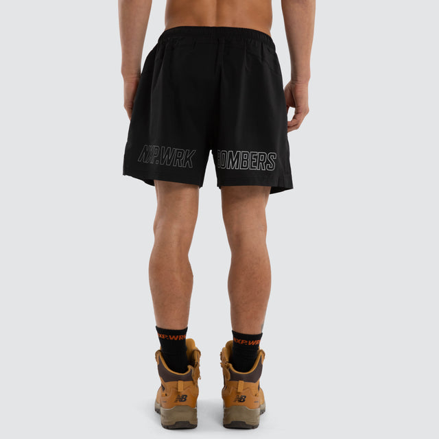 Model wears Essendon Bombers Contract Short Jet Black Shorts in Black - Image 2