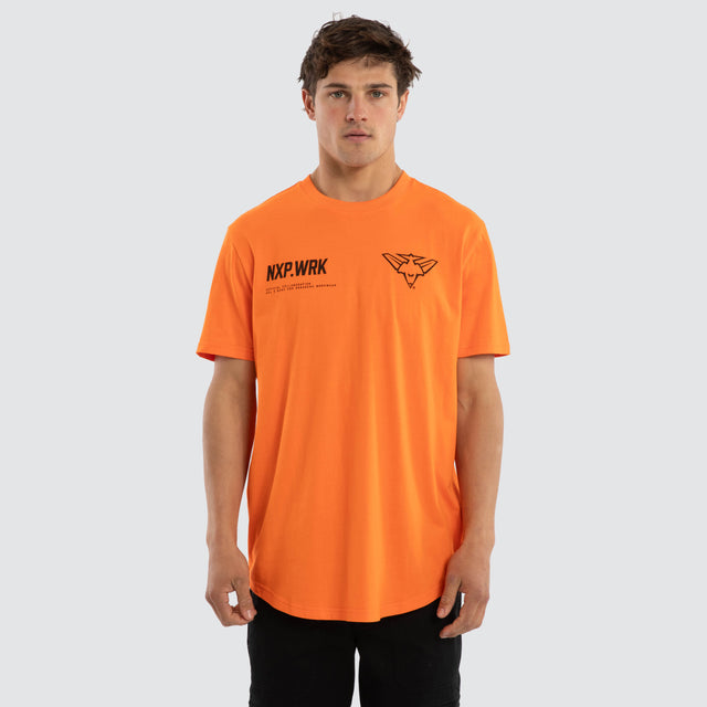 Model wears Essendon Bombers Ethic Tee Work Orange T-Shirts in Orange - Image 1