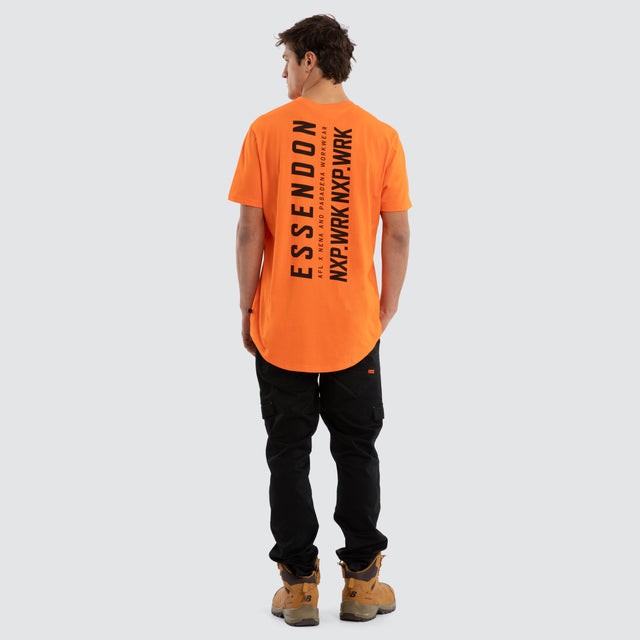 Model wears Essendon Bombers Ethic Tee Work Orange T-Shirts in Orange - Image 5