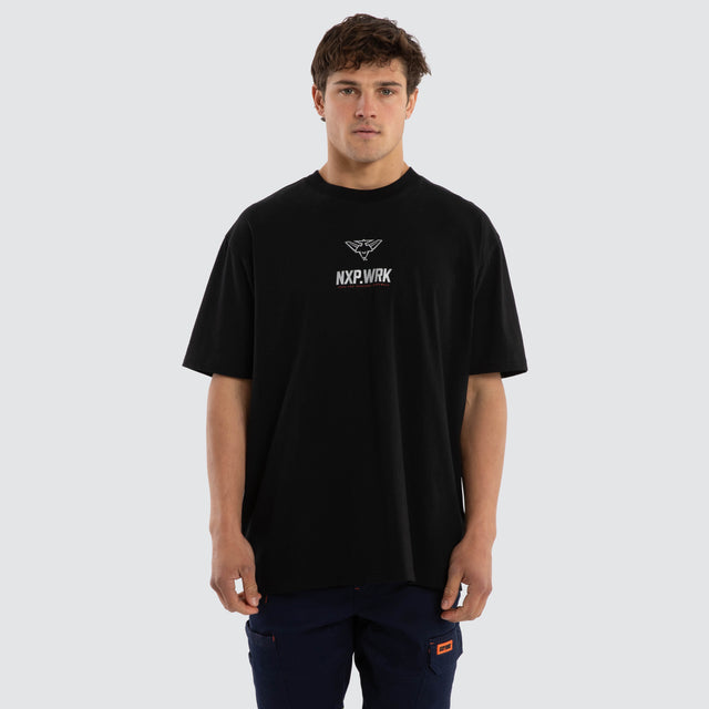 Model wears Essendon Bombers Union Tee Jet Black T-Shirts in Black - Image 1