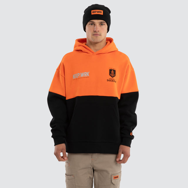 Model wears Fremantle Dockers Block Hoodie Orange Black Hoodies in Orange - Image 1