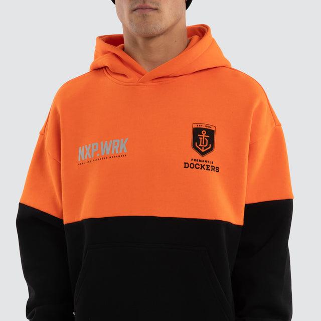 Model wears Fremantle Dockers Block Hoodie Orange Black Hoodies in Orange - Image 4