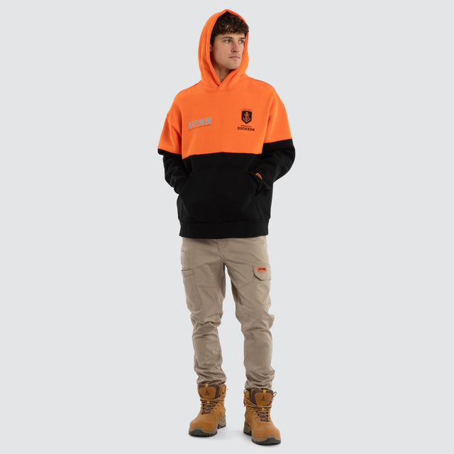 Model wears Fremantle Dockers Block Hoodie Orange Black Hoodies in Orange - Image 3