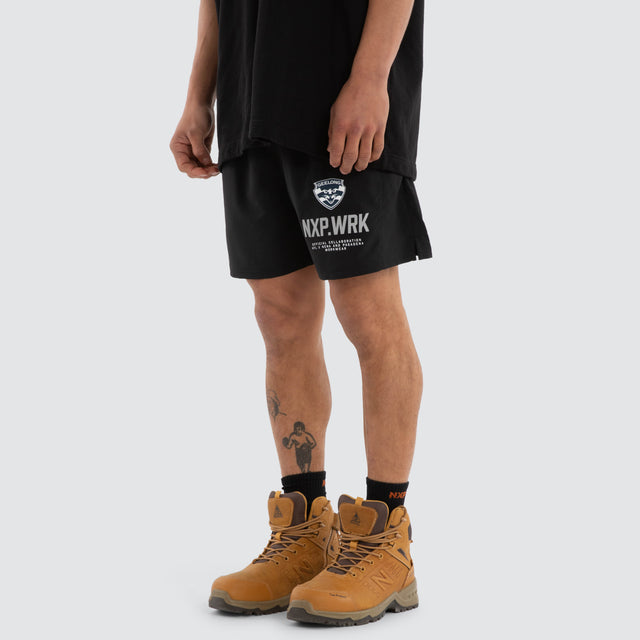 Model wears Geelong Cats Contract Short Jet Black Shorts in Black - Image 5