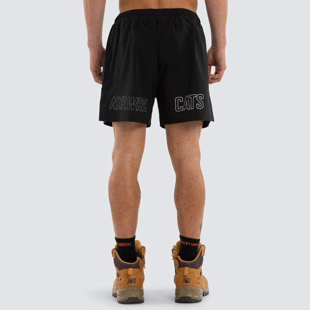Model wears Geelong Cats Contract Short Jet Black Shorts in Black - Image 3