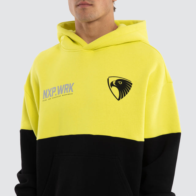 Model wears Hawthorn Hawks Block Hoodie Yellow Black Hoodies in Yellow - Image 4