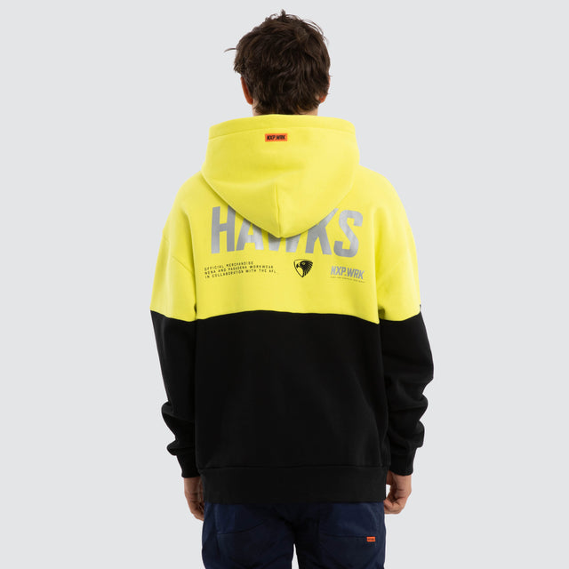 Model wears Hawthorn Hawks Block Hoodie Yellow Black Hoodies in Yellow - Image 2