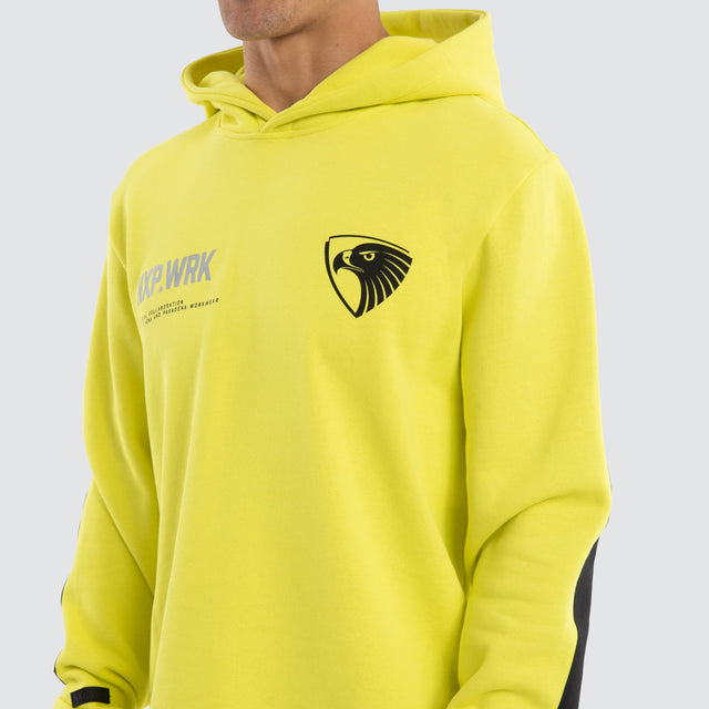 Model wears Hawthorn Hawks Admission Hoodie Yellow Hoodies in Yellow - Image 4
