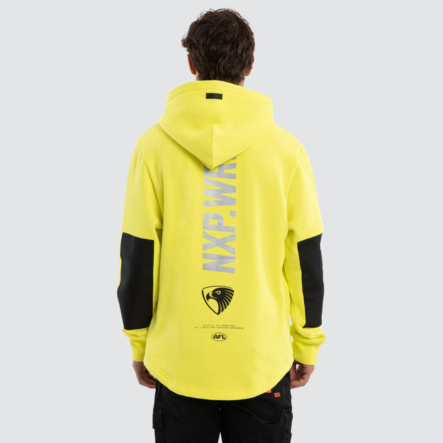 Model wears Hawthorn Hawks Admission Hoodie Yellow Hoodies in Yellow - Image 2