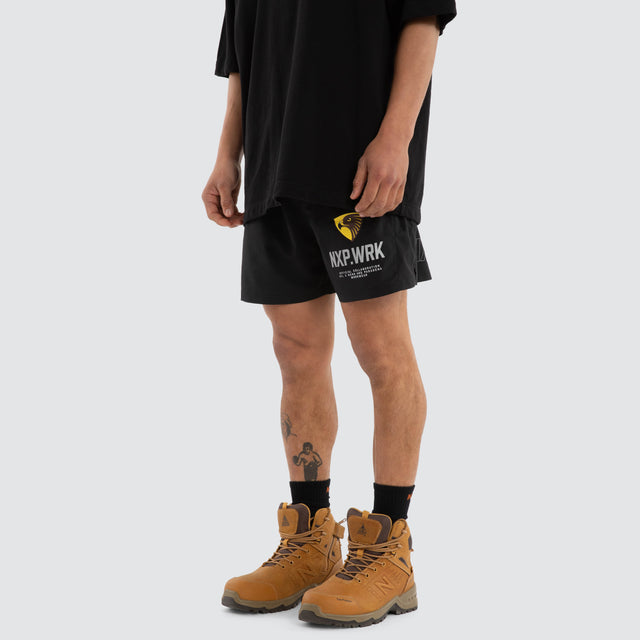 Model wears Hawthorn Hawks Contract Short Jet Black Shorts in Black - Image 4