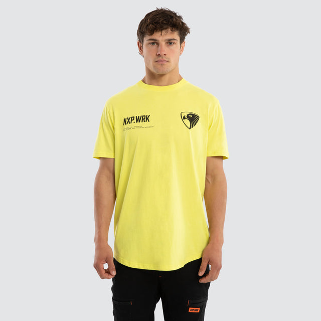 Model wears Hawthorn Hawks Ethic Tee Yellow T-Shirts in Yellow - Image 1