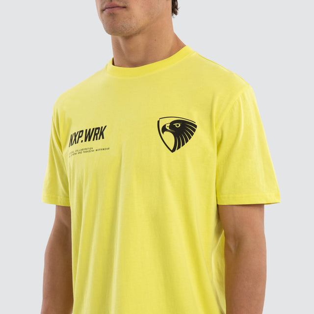 Model wears Hawthorn Hawks Ethic Tee Yellow T-Shirts in Yellow - Image 4