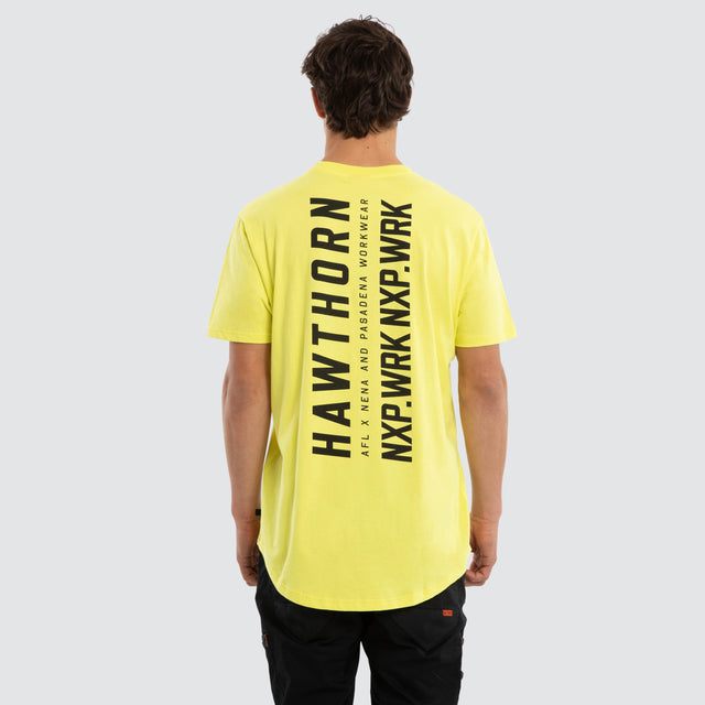 Model wears Hawthorn Hawks Ethic Tee Yellow T-Shirts in Yellow - Image 2