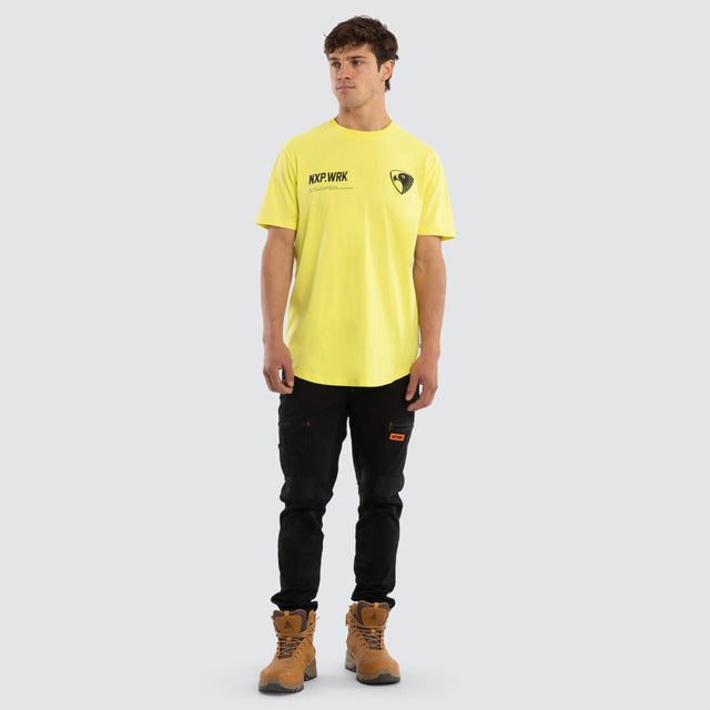 Model wears Hawthorn Hawks Ethic Tee Yellow T-Shirts in Yellow - Image 3