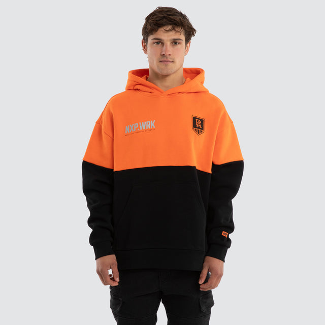 Model wears Port Adelaide Power Block Hoodie Orange Black Hoodies in Orange - Image 1