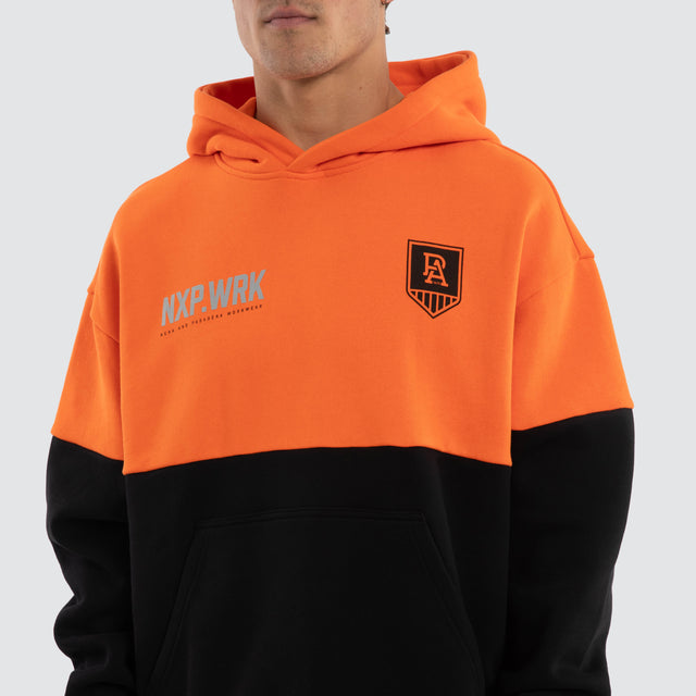 Model wears Port Adelaide Power Block Hoodie Orange Black Hoodies in Orange - Image 4