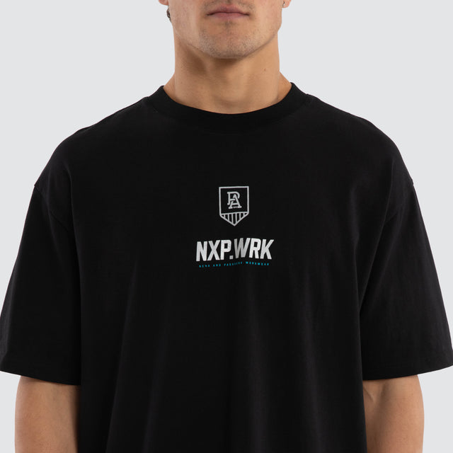 Model wears Port Adelaide Power Union Tee Jet Black T-Shirts in Black - Image 4