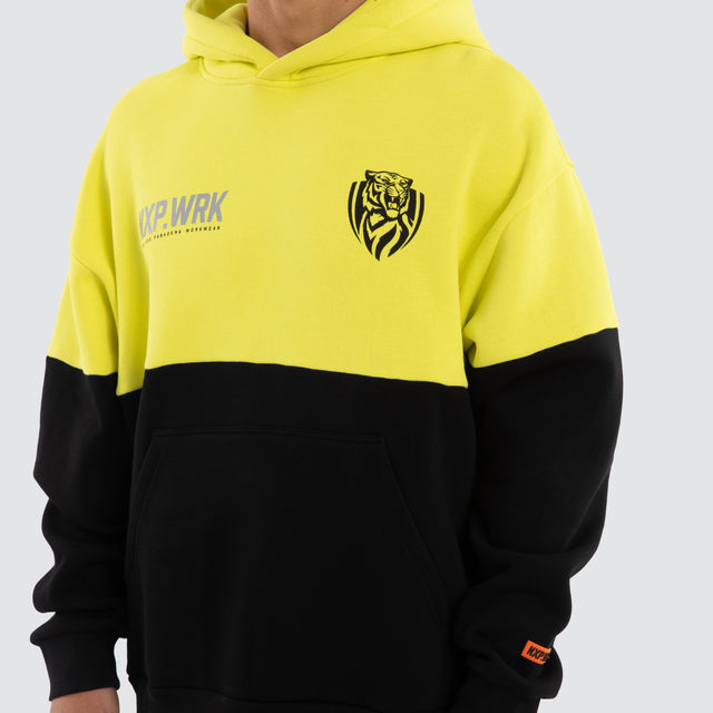Model wears Richmond Tigers Block Hoodie Yellow Black Hoodies in Yellow - Image 4
