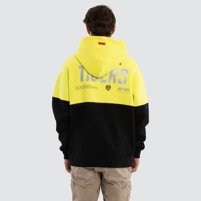 Model wears Richmond Tigers Block Hoodie Yellow Black Hoodies in Yellow - Image 2