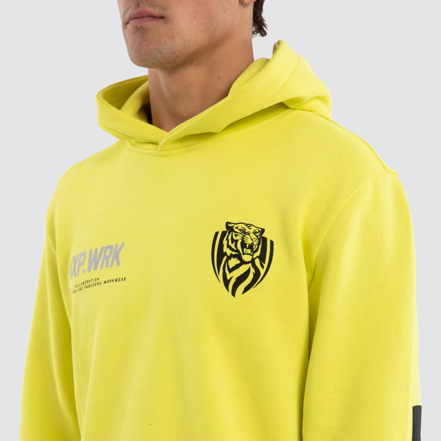 Model wears Richmond Tigers Admission Hoodie Yellow Hoodies in Yellow - Image 4