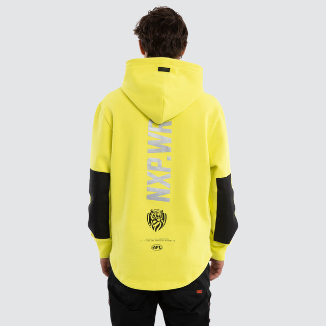 Model wears Richmond Tigers Admission Hoodie Yellow Hoodies in Yellow - Image 2