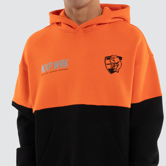 Model wears Western Bulldogs Block Hoodie Orange Black Hoodies in Orange - Image 4