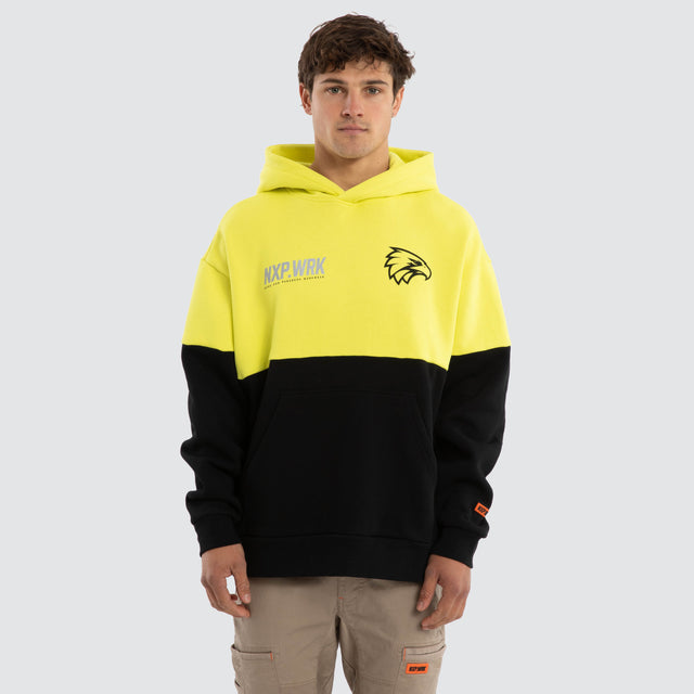 Model wears West Coast Eagles Block Hoodie Yellow Black Hoodies in Yellow - Image 1