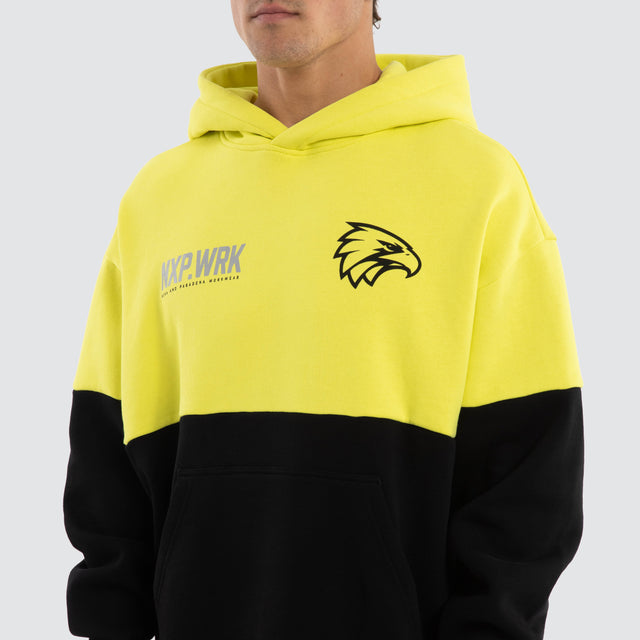 Model wears West Coast Eagles Block Hoodie Yellow Black Hoodies in Yellow - Image 4